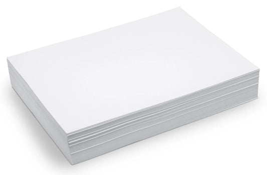 A ream-sized stack of blank white paper on a white background
